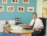 Paul Sheldon in his office