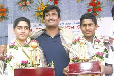 Shaibaaz and Manoj with their coach Harish.