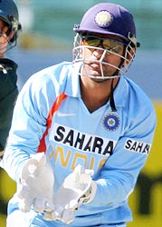 Mahendra Singh Dhoni in action with the gloves that were later ruled as "illegal"