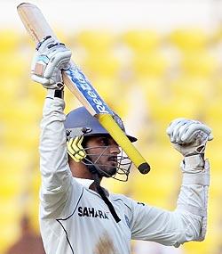 Harbhajan Singh celebrates completing his half-century in the fourth and final Test against Australia in Nagpur