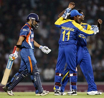 Sri Lankan players celebrate the wicket of Gautam Gambhir
