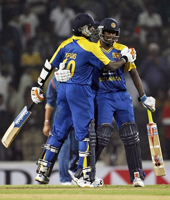 Mathews and Ajantha Mendis hug each other after the winning runs is scored