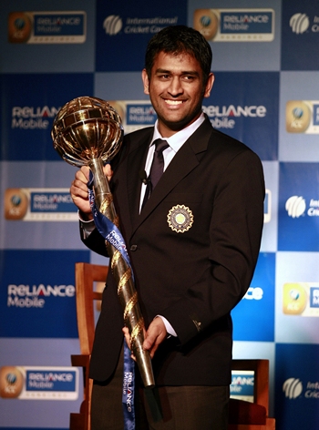 Dhoni receives the mace from ICC CEO Haroon Lorgat
