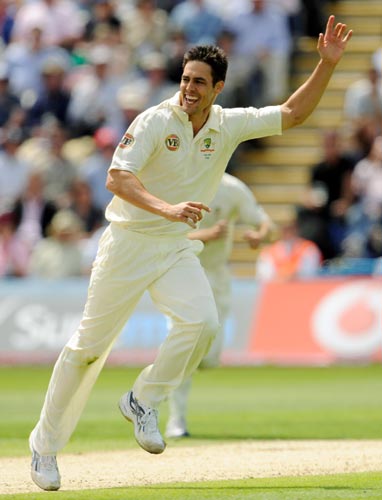 Australia's Mitchell Johnson celebrates taking the wicket of England's Ravi Bopara during the first Ashes Test at Cardiff