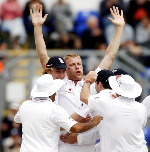 Andrew Flintoff celebrates the wicket of Hughes