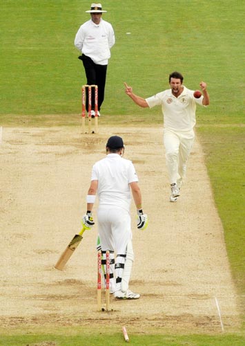 Australia's Ben Hilfenhaus celebrates after bowling England's Pietersen during the first Ashes Test in Cardiff