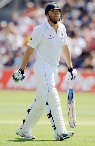 England's Andrew Flintoff leaves the field after being caught by Australia's Ricky Ponting during the first Ashes Test at Cardiff