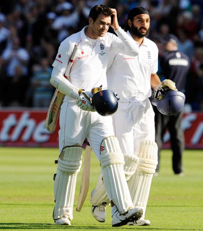 England's James Anderson (left) and Monty Panesar leave the field after securing a draw in the first Ashes Test against Australia at Cardiff