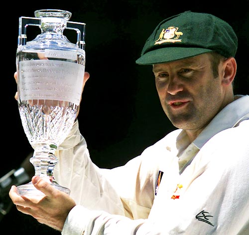 Australia captain Mark Taylor holds the Waterford Crystal trophy after winning the 1998-99 Ashes Test series