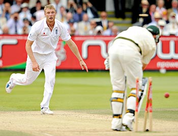 Andrew Flintoff claims the wicket of Peter Siddle