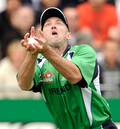 Ireland's Jeremy Bray takes a catch to dismiss Bangladesh's Junaid Siddique