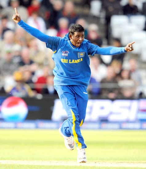 Ajantha Mendis celebrates getting the wicket of Mike Hussey