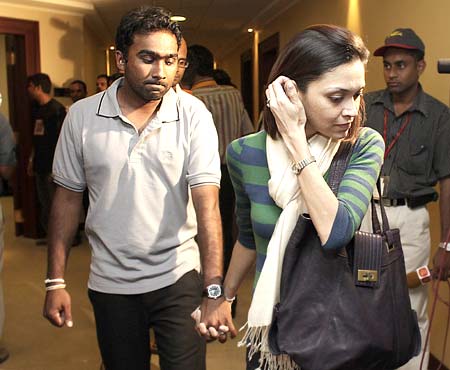 Mahela Jayawardene with his wife Christina Sirisena walk out of the Colombo airport terminal on returning home after the Lahore attack.