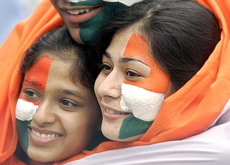 Female Indian cricket fans enjoy their time during a match