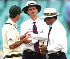 Ricky Ponting (left) with umpires Billy Bowden (centre) and Aleem Dar
