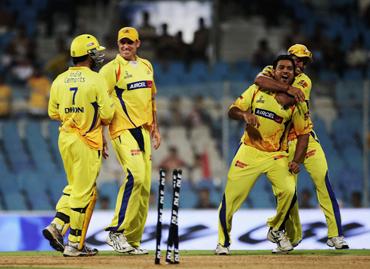 Shadab Jakati of the Super Kings celebrates with team mates the wicket of Mohnish Mishra