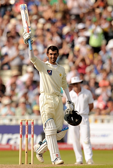 Zulqarnain Haider raises his bat after completing his half-century
