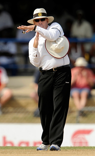 Umpire Daryl Harper calls for a referral during the fifth cricket test match between the West Indies and England