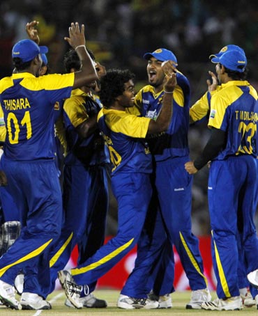 Sri Lanka's players celebrate the dismissal of Virender Sehwag