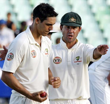 Mitchell Johnson (left) with Ricky Ponting