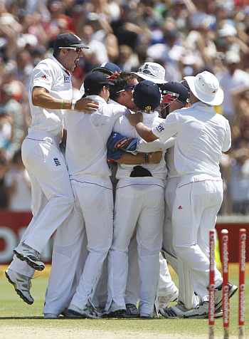 The England team celebrate winning the second Ashes Test in Adelaide