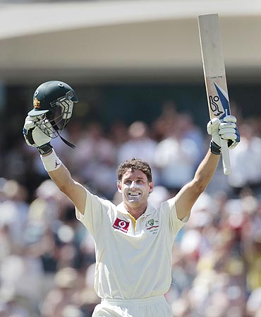 Australia's Michael Hussey celebrates after completing his century