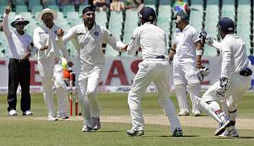 India's Harbhajan Singh celebrates after dismissing South Africa's AB de Villers during the second Test in Durban
