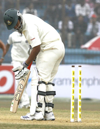 Bangladesh's Tamim Iqbal looks on disappointedly after being bowled by Zaheer Khan