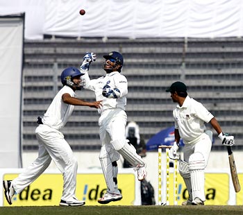 India captain and wicketkeeper Mahendra Singh Dhoni takes the catch to dismiss Mohammad Ashraful