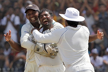 Muralitharan reacts after dismissing Pragyan Ojha, his 800th wicket