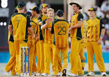 Australian team celebrates after picking up a wicket