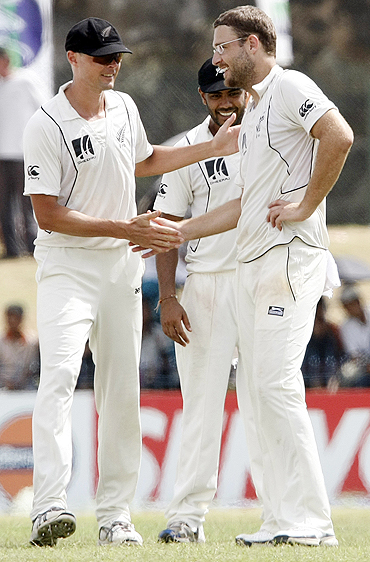 Chris Martin (left) with Daniel Vettori