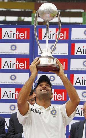 India captain MS Dhoni holds aloft the Border Gavaskar trophy after the series win on Wednesday