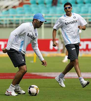 Yuvraj Singh plays football during a practice session