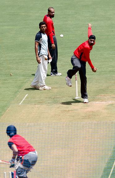 Harbharjan Singh sends down a delivery during training ahead of Saturday's final