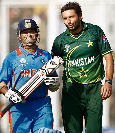 Sachin Tendulkar (left) and Shahid Afridi exchange words after Tendulkar was dropped by Younis Khan during their World Cup match last week