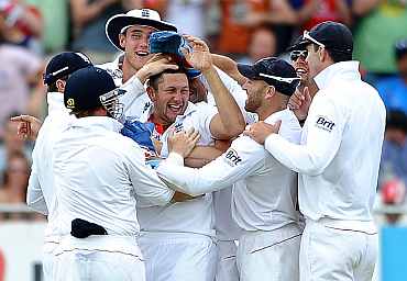 England Team celebrate after a fall of a wicket