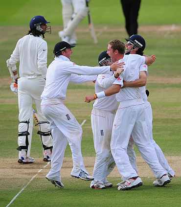 England players celebrate after winning the first Test