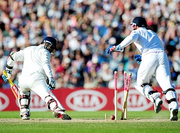 Virender Sehwag is bowled by Graeme Swann as wicketkeeper Matt Prior (right) celebrates