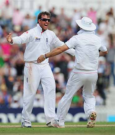 Graeme Swann celebrates after picking a wicket
