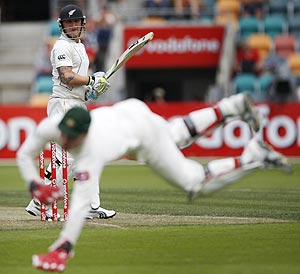 New Zealand's Brendon McCullum watches Australia's keeper Brad Haddin chase down the ball during the second Test, at Bellerive Oval in Hobart, on Saturday