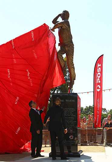 Shane Warne poses during the unveiling of the Shane Warne statue at the Melbourne Cricket Ground