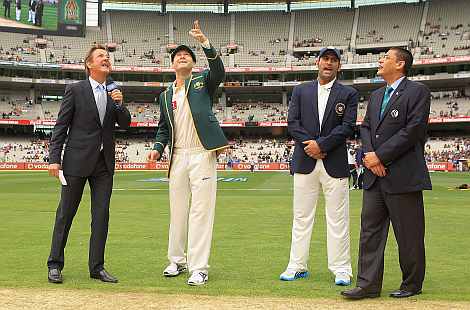 Michael Clarke and Mahendra Singh Dhoni during the toss ahead of the start of the first Test match