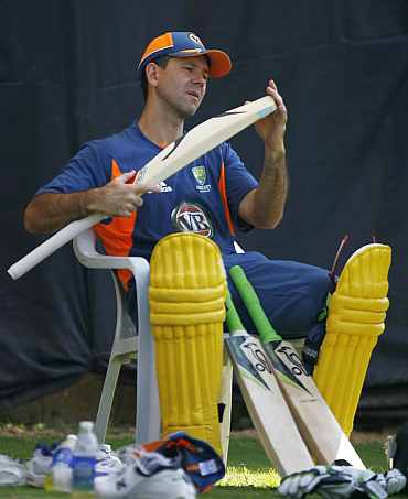 Ricky Ponting checks his bat during a practice session in Ahmedabad