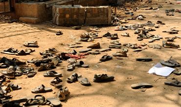 Debris and footwear left abandoned outside the stadium