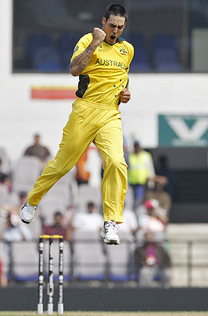 Australia's Mitchell Johnson celebrates after taking the wicket of New Zealand's Jesse Ryder 