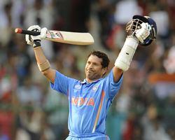 Sachin Tendulkar celebrates after getting to 100