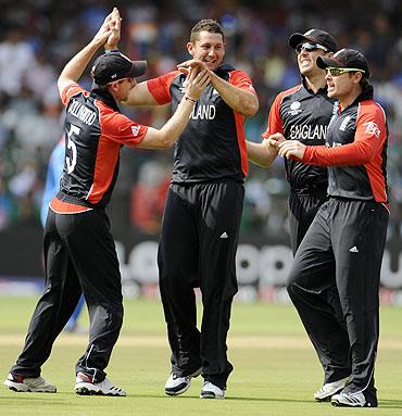 Tim Bresnan is congratulated by teammates after taking wicket of Virender Sehwag