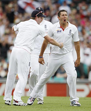 England's Paul Collingwood (left) celebrates with Tim Bresnan after claiming the wicket of Australia's Shane Watson on Monday