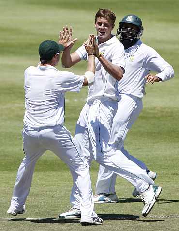 South African players celebrate after taking an Indian wicket